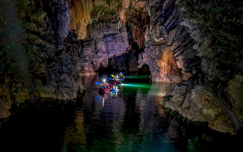 Kayaking inside the cave offers a thrilling adventure as you navigate through narrow rock passages and silent underground streams